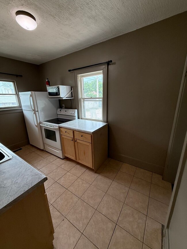 Photo - Charming 2-Bedroom Home with Spacious Backyard and 2-Car Garage