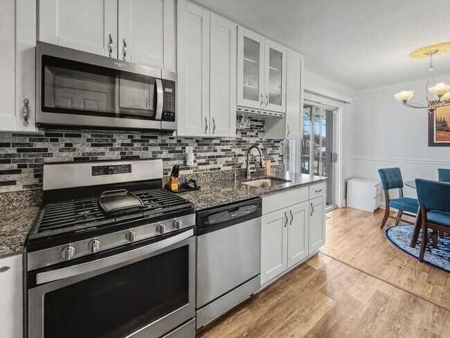 Photo - Furnished 4BD 2BA Home with Two kitchens, Basement, and Garage!