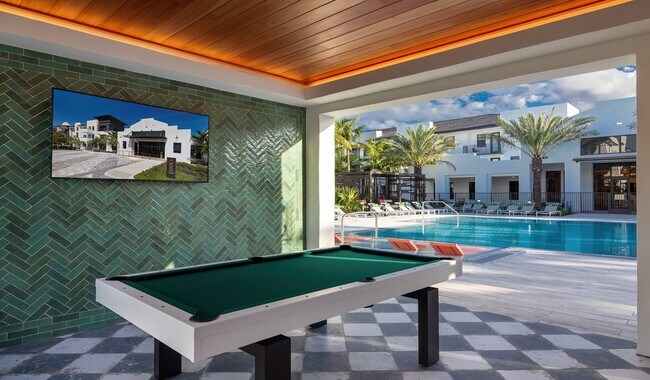 Challenge friends to a game and soak up the sunshine with our outdoor billiards table - Solea at Miami Lakes