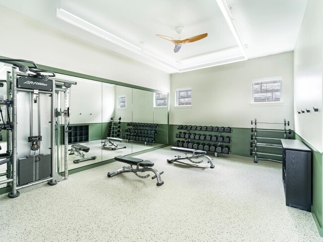 Stretch, lift, and focus on your form in this strength-training space outfitted with benches, free weights, and floor-to-ceiling mirrors.