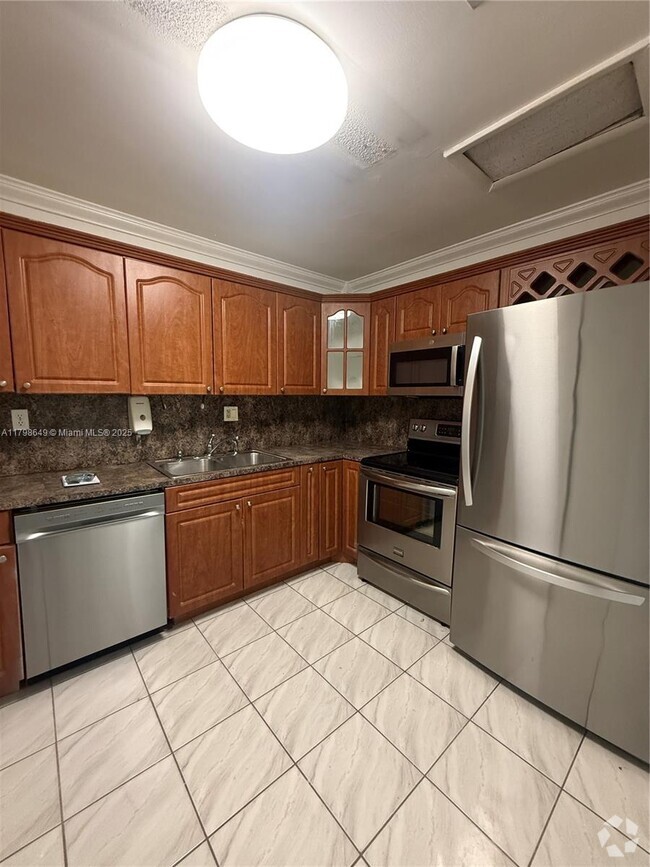 Building Photo - 12831 SW 43rd Dr Unit 247-A Rental