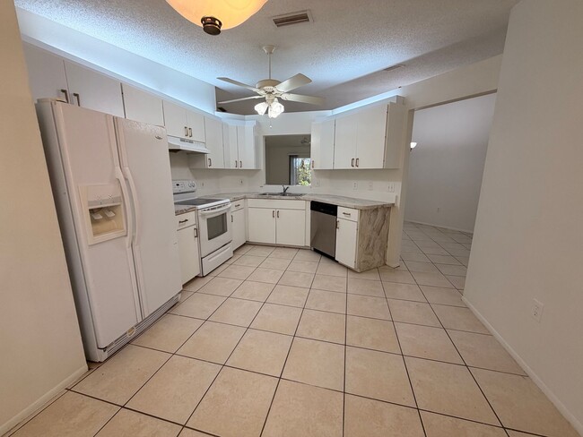 Photo - Centrally located 3/2 with 2 car garage. Pet friendly with fenced in backyard. Lawncare included.
