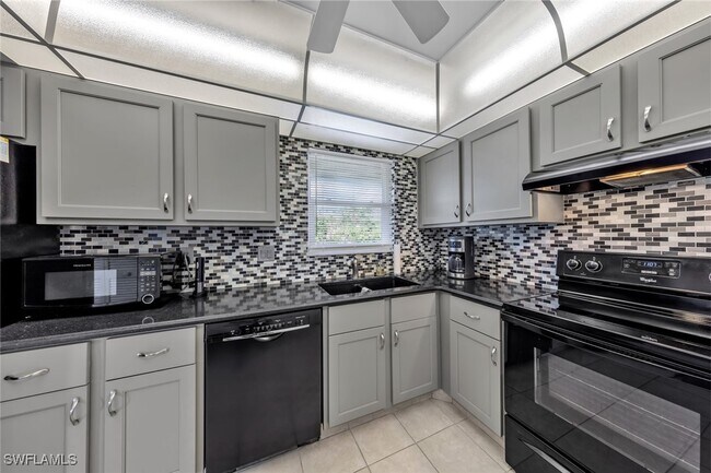 Building Photo - 12250 Tamiami Trl E Unit 1402