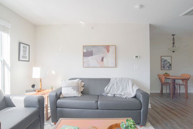 Bright living room area. Furnished options available.