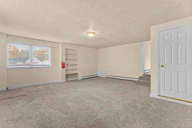 Living area - fresh wall to wall carpet - 333 Groveland St Unit 3