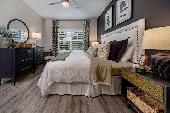 Large Primary Bedroom with Hardwood Style Flooring