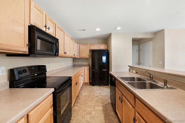 Photo - Bright Open-Concept Condo with 1-Car Garage in Prime Commuter Location