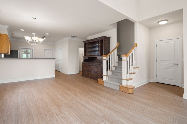 Photo - Five-Bedroom Tudor Home with Main-Level Primary Suite in Albemarle Reserve