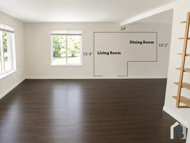Bright welcoming living room with a view of lawn and mature evergreens - 20981 Port Gamble Rd NE