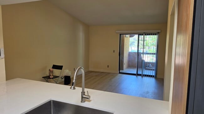 From kitchen toward patio - 1351 N Pleasant Dr Unit Chandler 2 Bd, 1.5 Ba