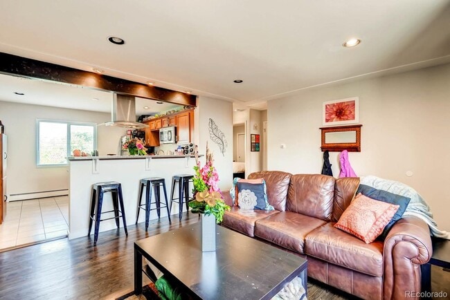 Living room to kitchen - 2838 Xavier St Unit back