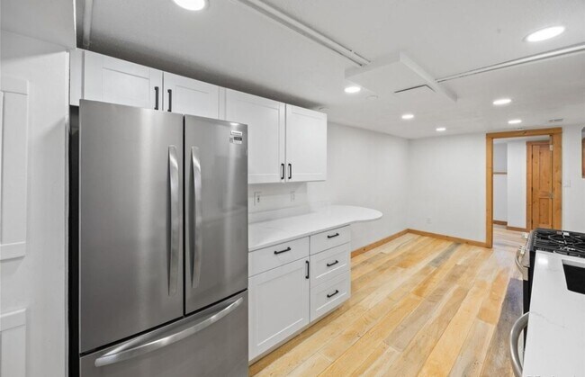 French door refrigerator and counter height peninsula