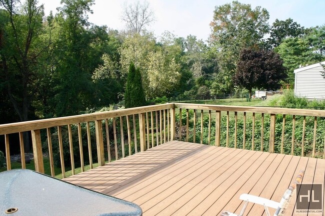 3.5BR 1.5BA Triplex w/ Elevated Wood Deck, Vegetable Garden, Private Parking, Waterfall & Finishe...