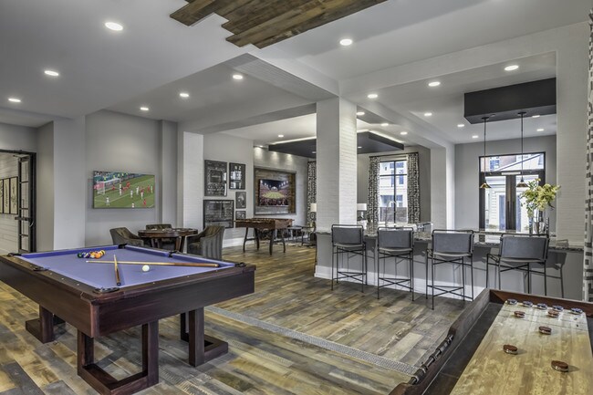 Sports Lounge equipped with billiards, poker table, shuffleboard and wall Scrabble®