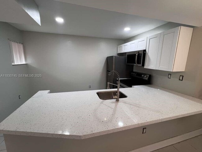 Building Photo - 6395 W 27th Ct Unit 102