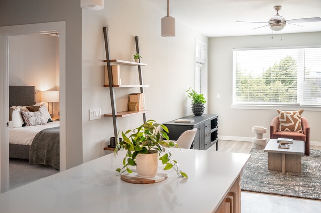 Living area with hard surface flooring and granite kitchen island