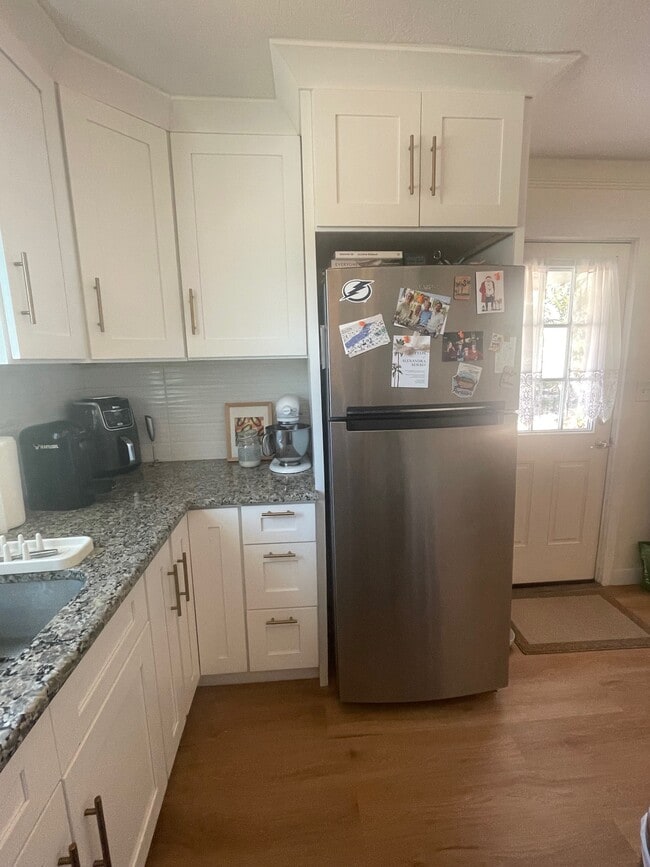 Kitchen - view of fridge and front door - 1134 Bay St NE Unit 1134-1/2 Bay ST NE