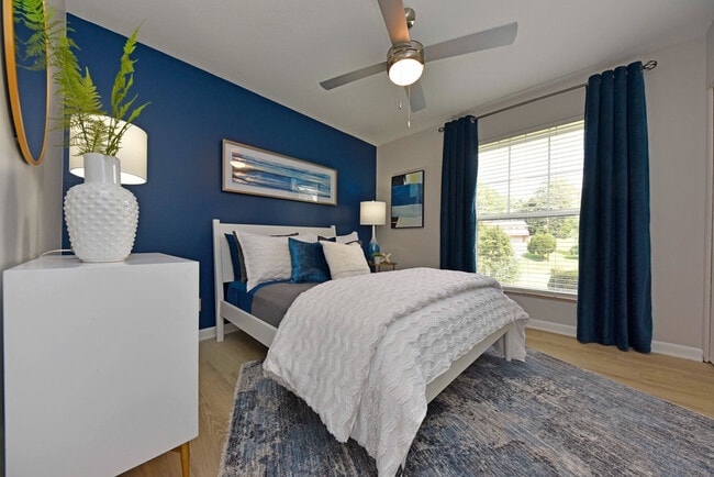 Bedroom with hardwood-style flooring