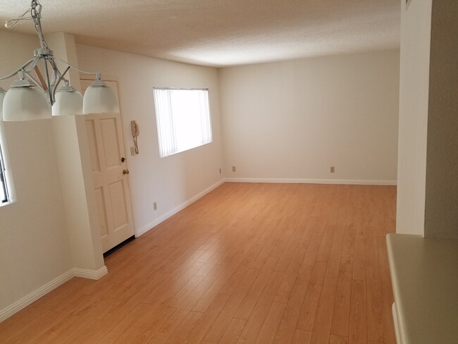 2 Bedroom 2 Bath Living Room with entrance door - 520 Fischer St Apartments