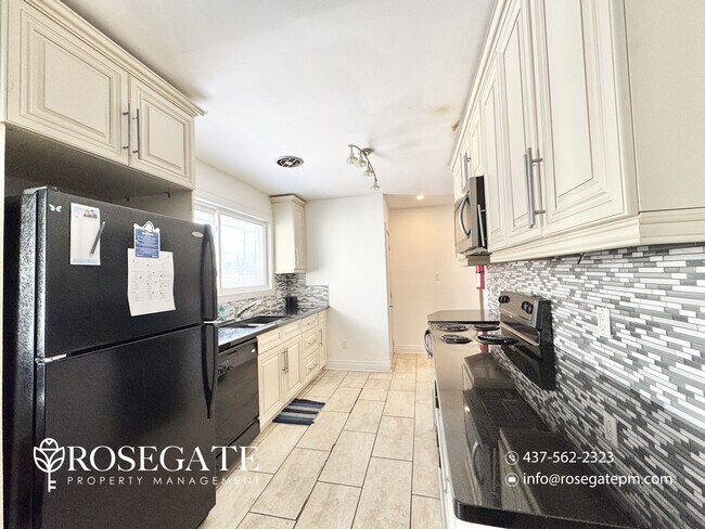 Photo - Charming 2-Bedroom Detached Home with Fireplace & Backyard Deck in Oshawa