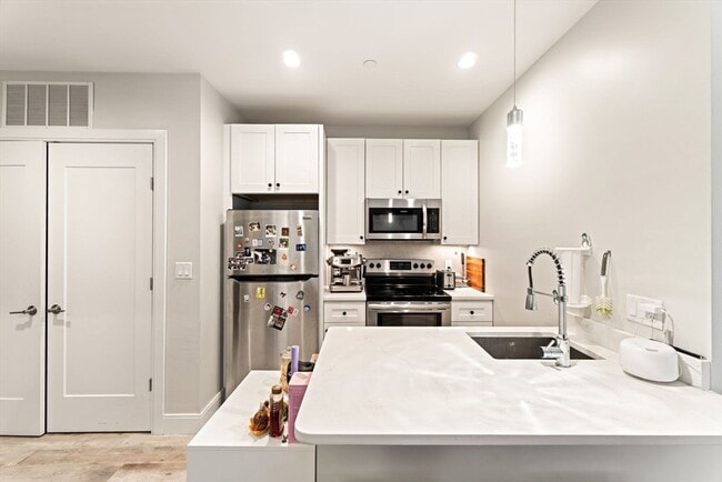 Building Photo - 1457 Tremont St Unit 210