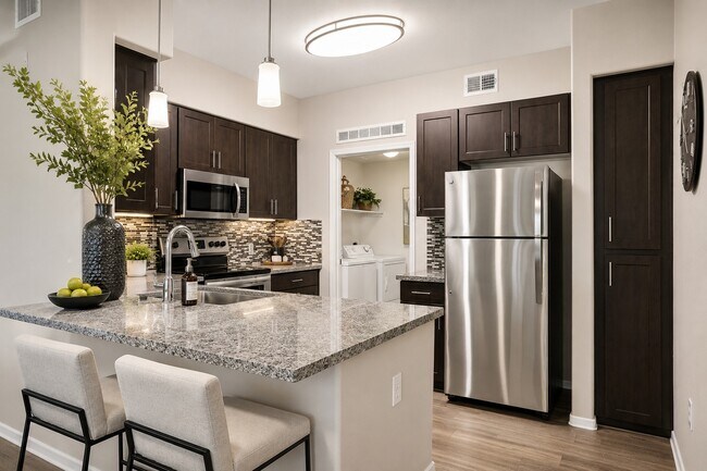 Elevate your lifestyle at Highland Groves at Morrison Ranch. This stunning kitchen features modern stainless steel appliances, chic cabinetry, and elegant countertops – perfect for culinary enthusiasts. Schedule a tour today and see it for yourself!