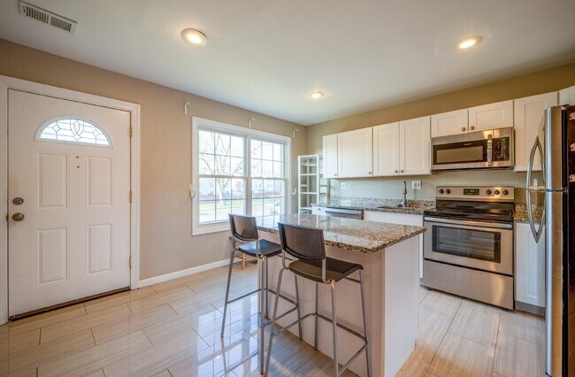 Photo - Spacious 3-Level Townhouse with Finished Basement and Fenced Patio