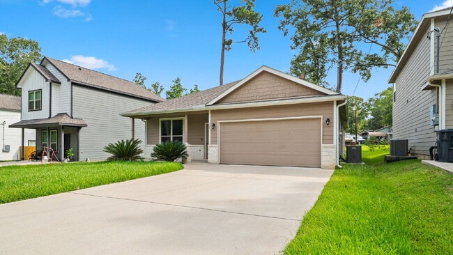 Photo - Welcome home to this beautifully maintained 2021 single-story home in desirable Lake Conroe Fores...