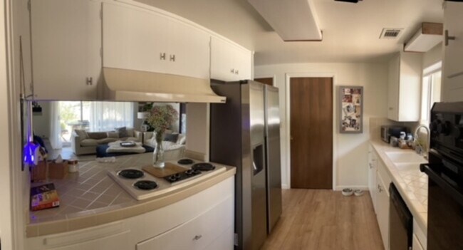 Photo - 4 Bed, 2 Bath Hillside House w/ New Floori...