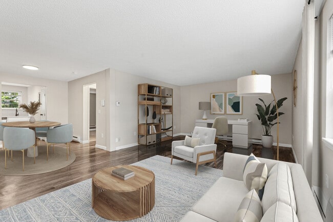 Livingroom, dining area peering into kitchen