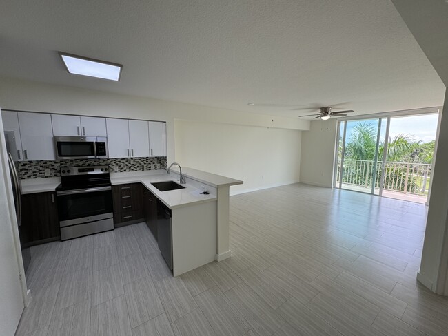 Living Room & Kitchen View - 405 NE 34th St Apartments Unit A