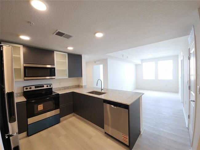 Building Photo - 5563 Millennia Park Dr Unit 221