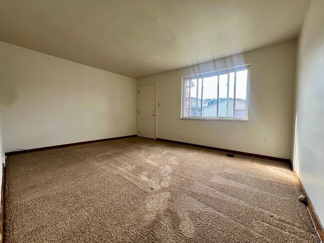 Photo - Cozy Two Bedroom Townhome with Central AC & Off-Street Parking! Call Today to Schedule a Tour!