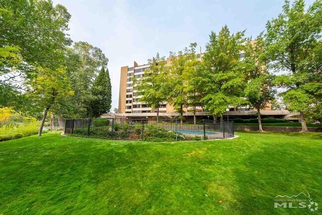 Building A with pool in foreground - 1200 Riverside Dr Unit 1295 Rental