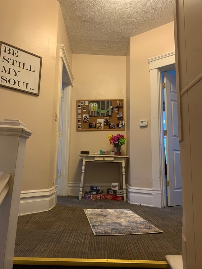 Top of steps - hallway into two bedroomsm - 628 Hal Greer Blvd Unit 2