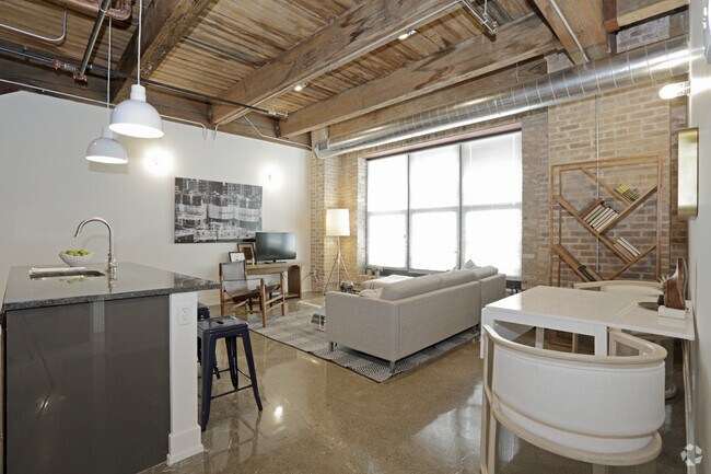 Exposed brick lofts w/soaring timber beamed ceilings - The Otis