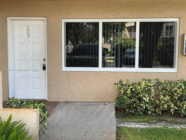 Building Photo - 8670 NW 6th Ln Unit 4-107 Rental