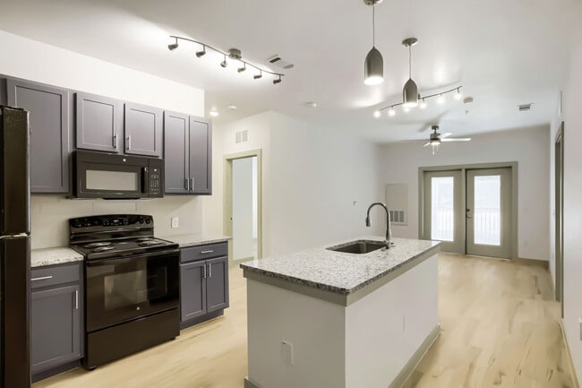 kitchen island and living room - Cleveland Pioneer Crossing