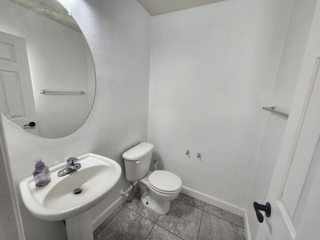Photo - Sleek 2 story home with tile in most living areas and upgraded kitchen.