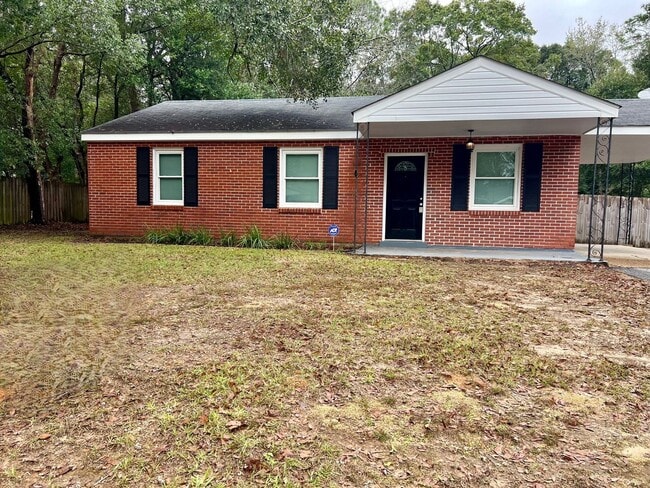 Building Photo - 3/1 Brick Home with Carport w/ fenced in yard
