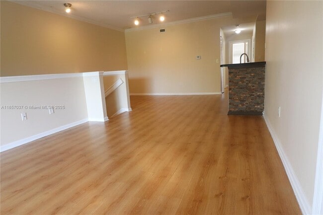 Building Photo - 5880 W Sample Rd Unit 303 Rental