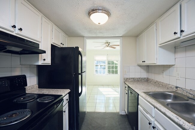 Photo - 2BR/2.5BA Townhome Gem with Fenced Yard, Fireplace & Bay Windows