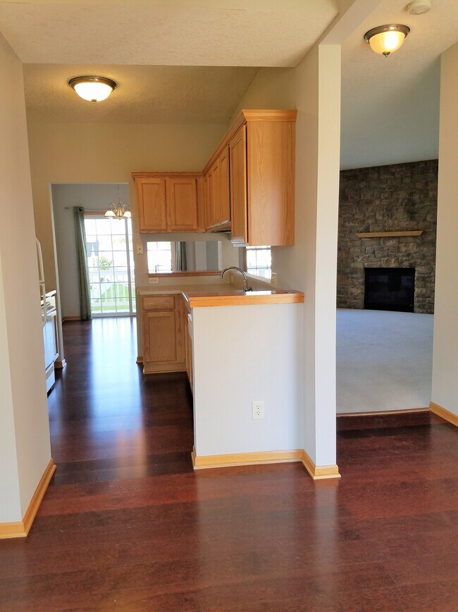 View from office space showing living room and kitchen