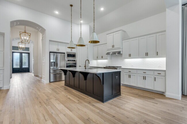 Photo - "Luxurious 4-Bed Retreat with Movie Room & Marble Elegance in Celina, TX!"