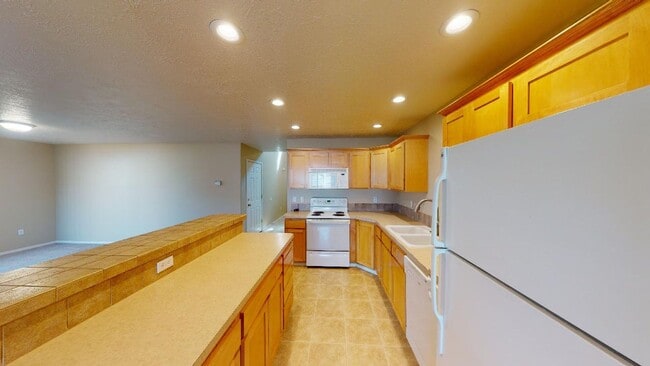 Photo - Updated Two Level Home in Sandy with Backyard. Pet Friendly