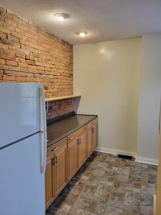 Exposed Brick Tile Floors - 629 Oak St Unit 629BOakStreet