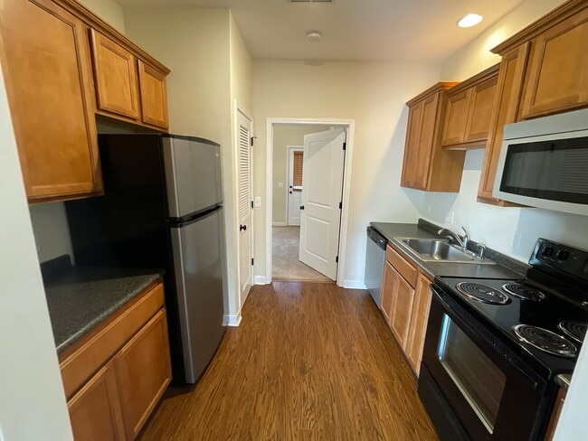 Building Photo - OLD MAIN CONDOS 1BR | Walk to Cotton District | Fall ‘26 AVAILABILITY Unit 1