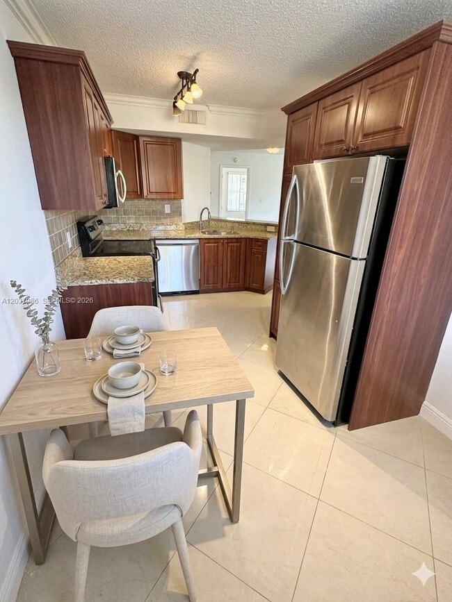 Photo - 8955 Wiles Rd Unidad 208