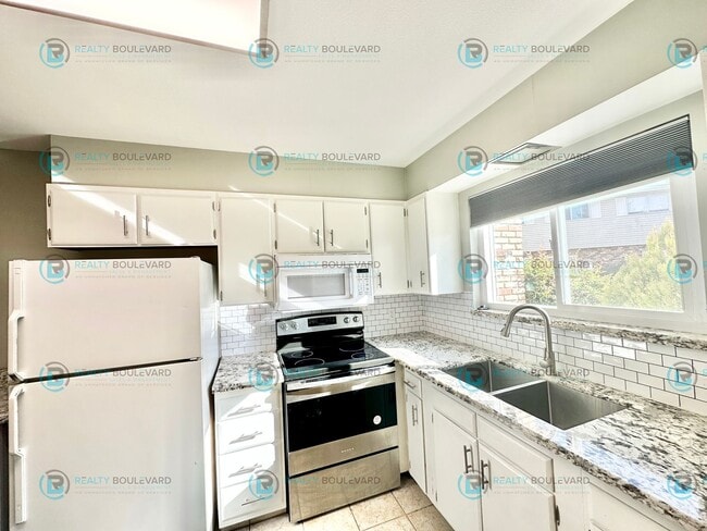 Photo - 2-bed, 2-bath, 2-story townhome with pool and park like setting outside the front door.