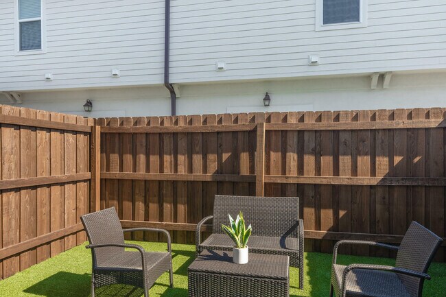 Relax in this cozy outdoor patio, perfect for enjoying sunny days.